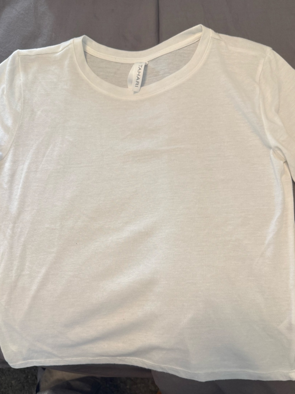 Tahari great condition White Short-Sleeve Tee. No signs of obvious wear.